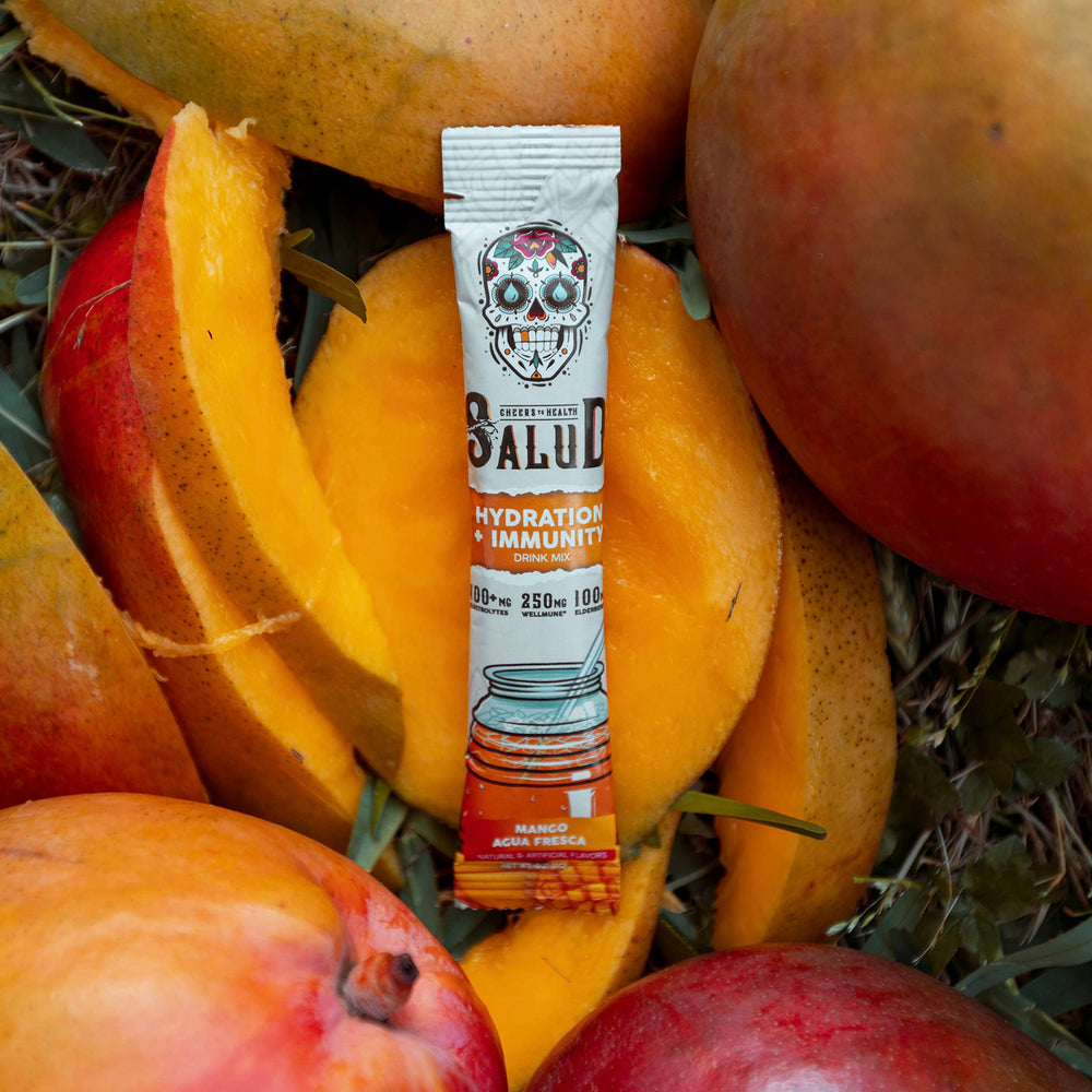 Taste Salud low calorie mango mix poured over ice for a light drink