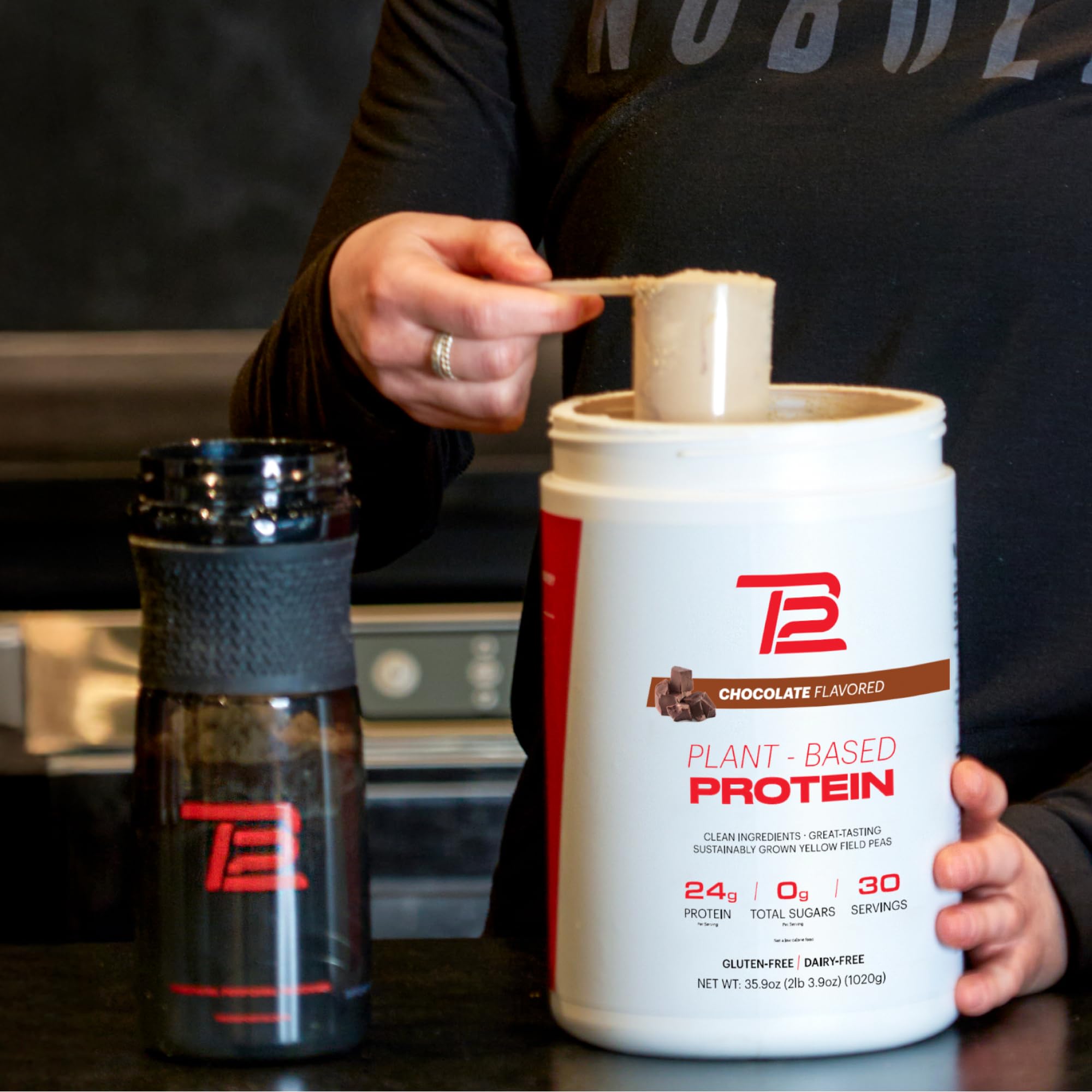 TB12 chocolate protein powder in a bottle conveying diet-friendly appeal