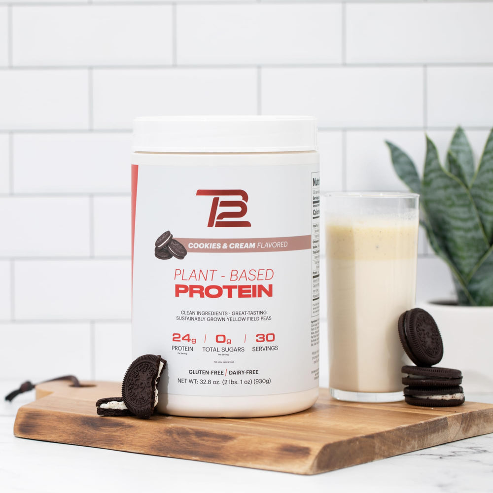 Kitchen setup showing TB12 meal replacement smoothie being prepared