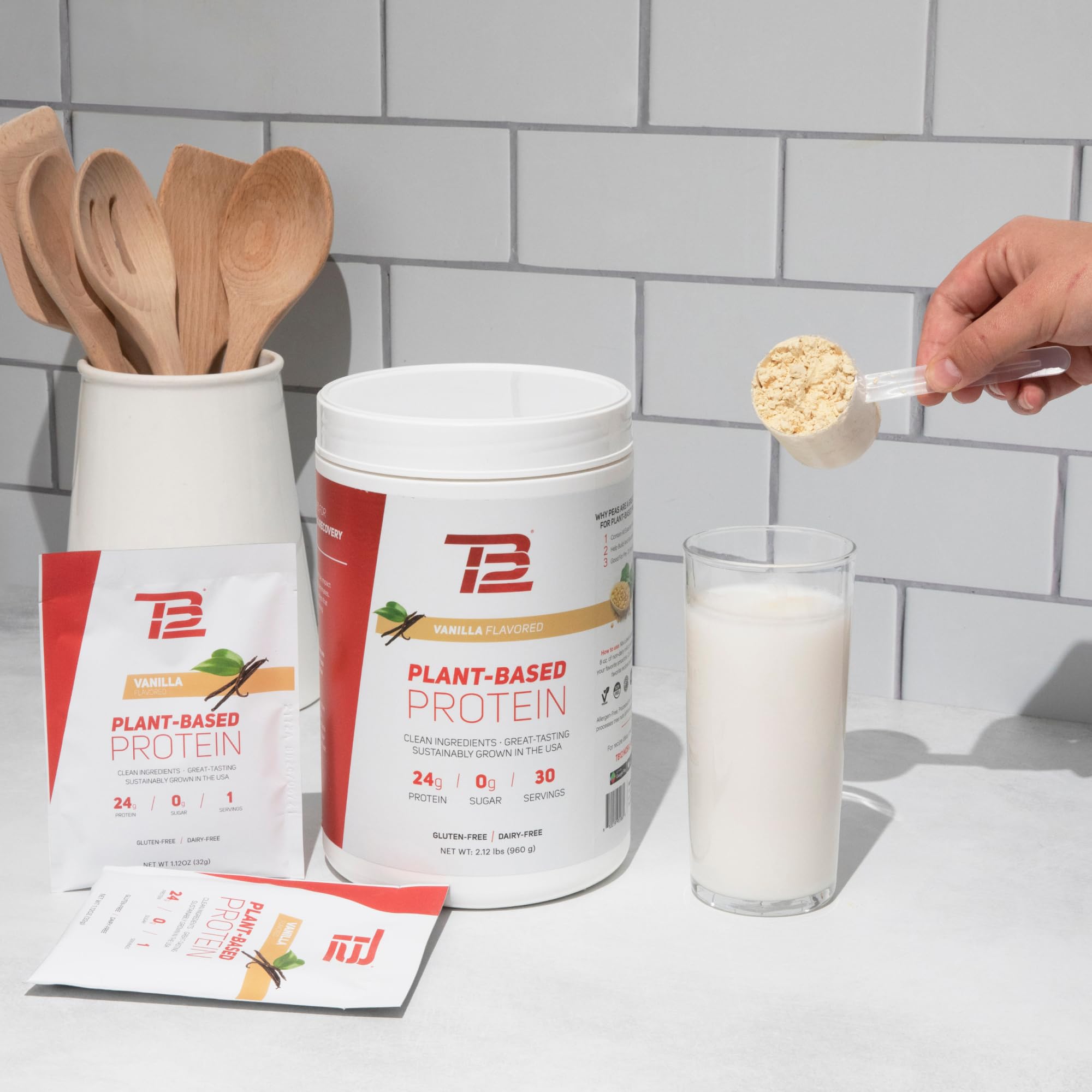TB12 vanilla flavor powder beside a nutritious breakfast bowl.