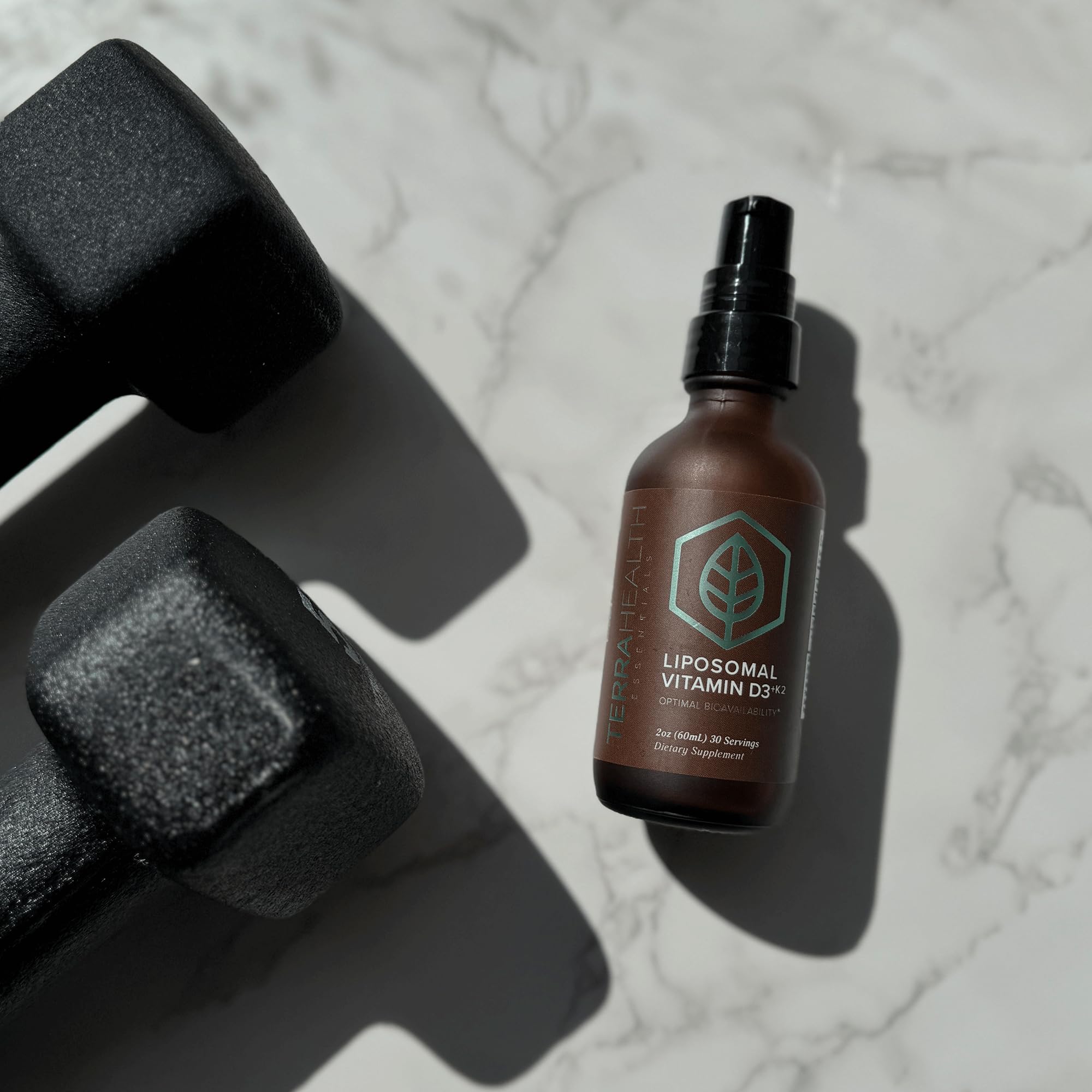 Terra Health Essentials bottle on desk suggests a personal wellness routine
