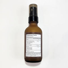Liquid texture close-up of Terra Health Essentials liposomal curcumin drops.