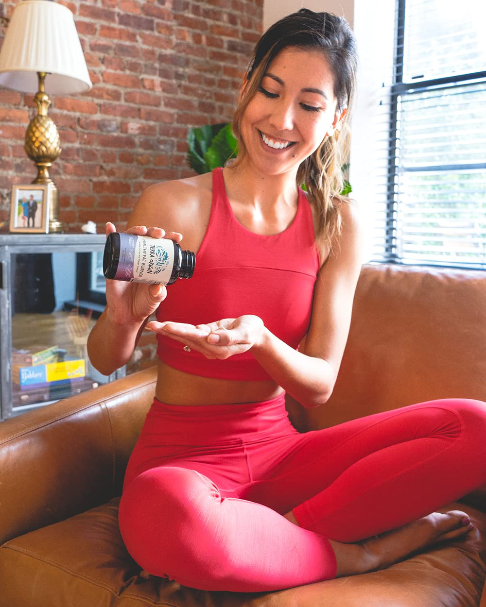 Terra Origin glass bottle on bright counter for healthy living.