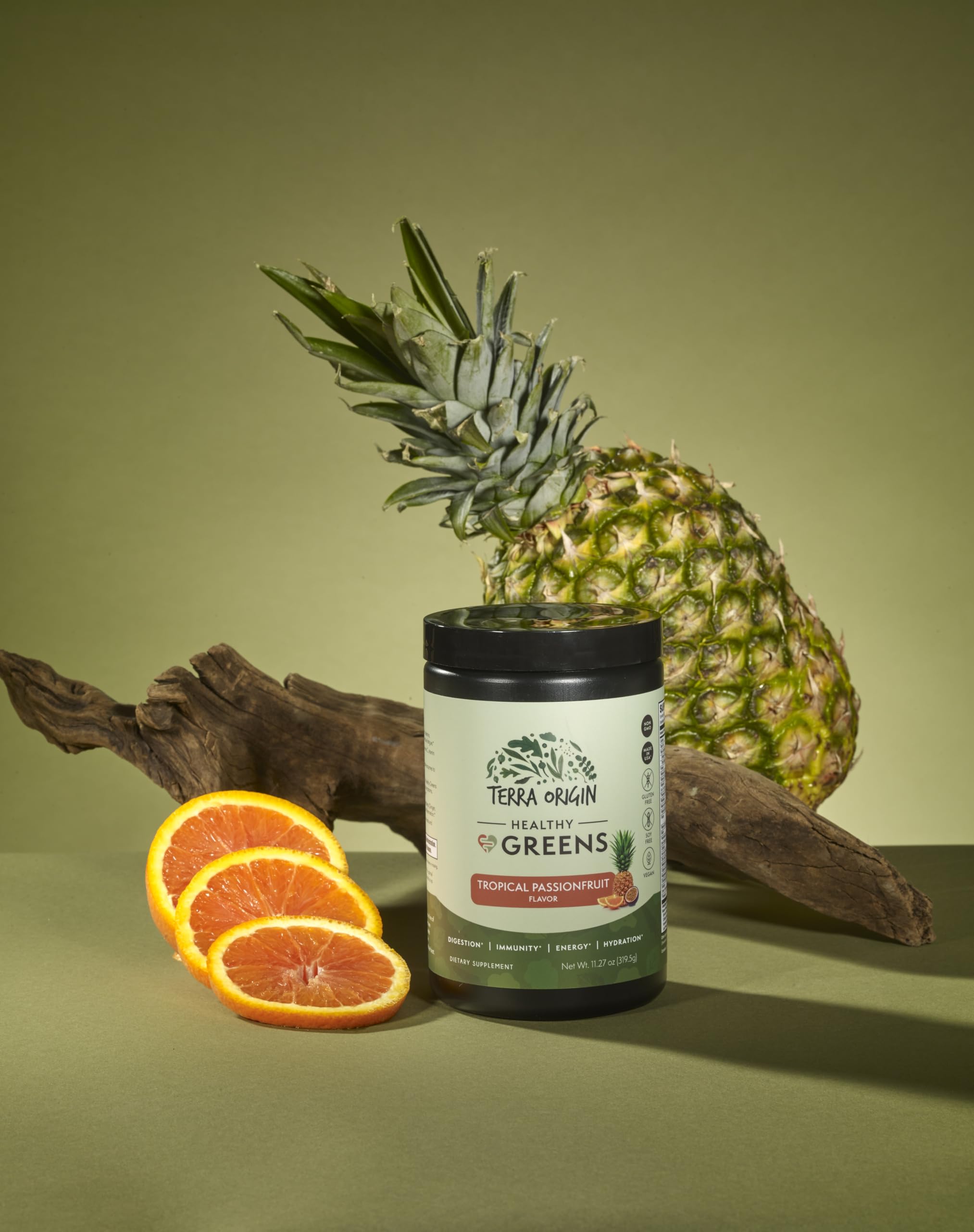 Terra Origin Healthy Greens jar close-up with label highlighting probiotic and enzyme blend