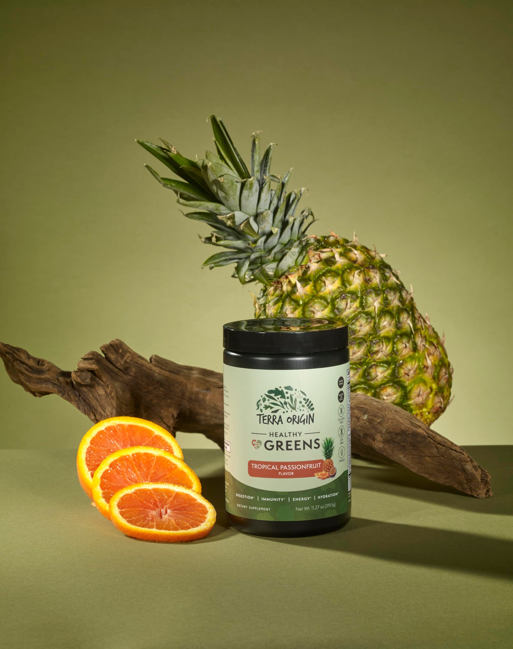 Terra Origin Healthy Greens jar close-up with label highlighting probiotic and enzyme blend