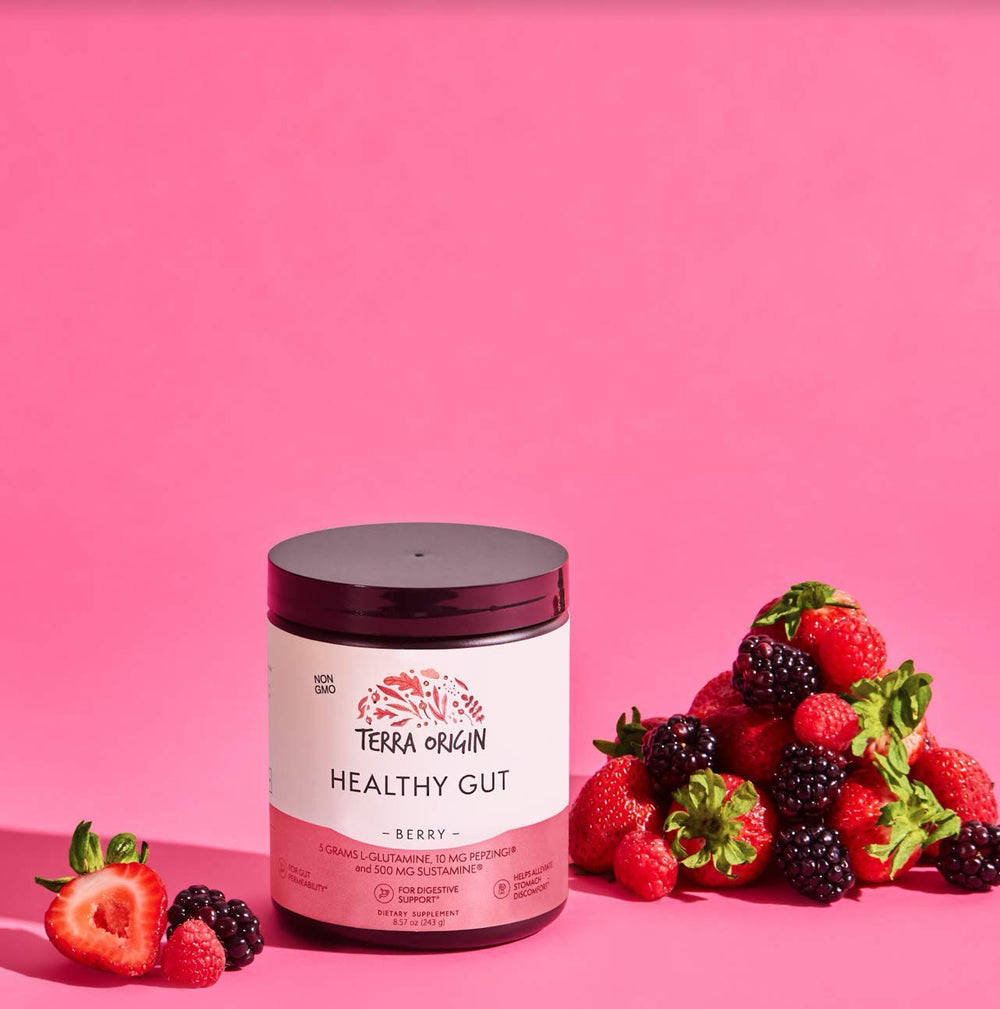 Powder dissolving in liquid with Terra Origin Healthy Gut Powder berry flavor