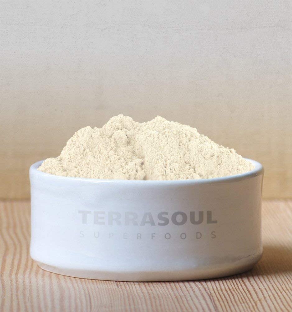 Terrasoul Organic Date Sugar poured into coffee for natural sweetness.
