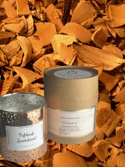Terreux Patchouli Sandalwood candle in copper jar; close-up for meditation ambiance.
