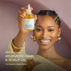 Thank God It's Natural tgin Miracle Styling Oil in hand for easy scalp massage