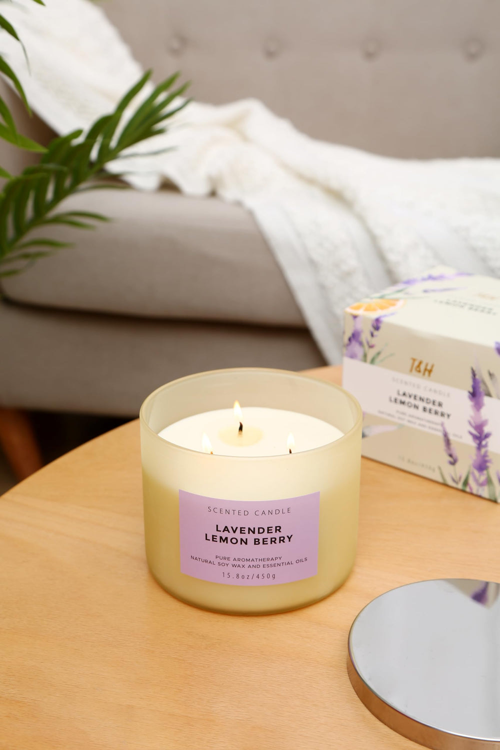 Candle burning with three wicks creating a calm glow