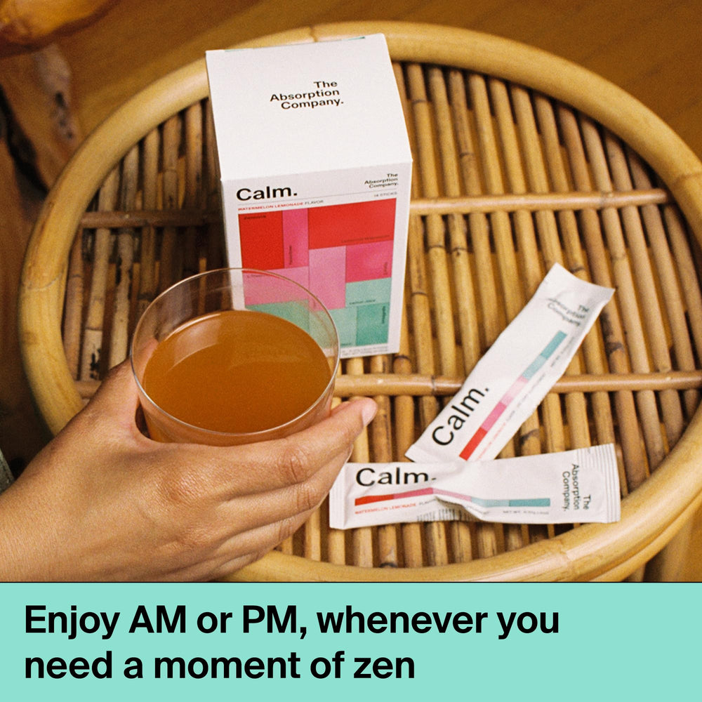 Stirring Calm Drink Mix in a glass after work for relaxation
