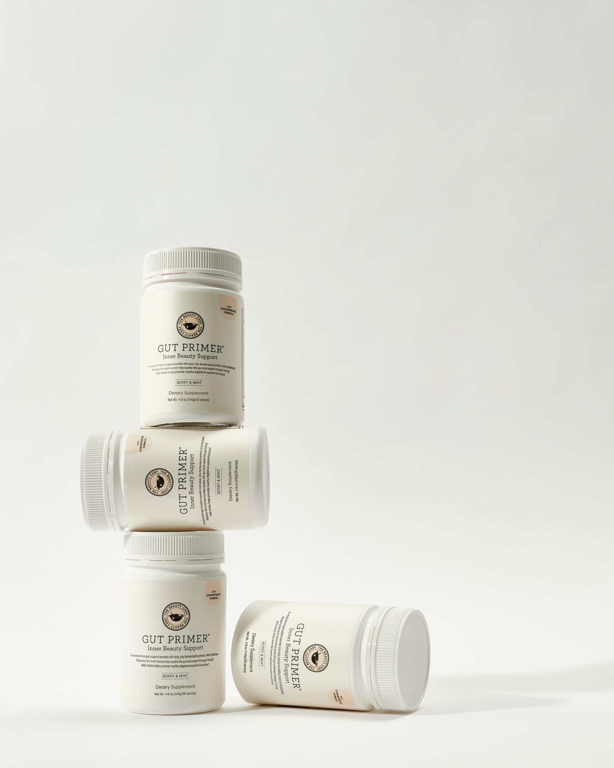 The Beauty Chef Gut Primer powder dispense demonstrates easy daily use for digestion support.