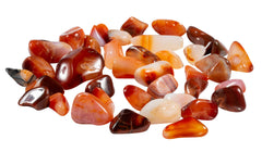 The Chrysalis Stone carnelian tumbled stones in a warm color palette for energy and focus