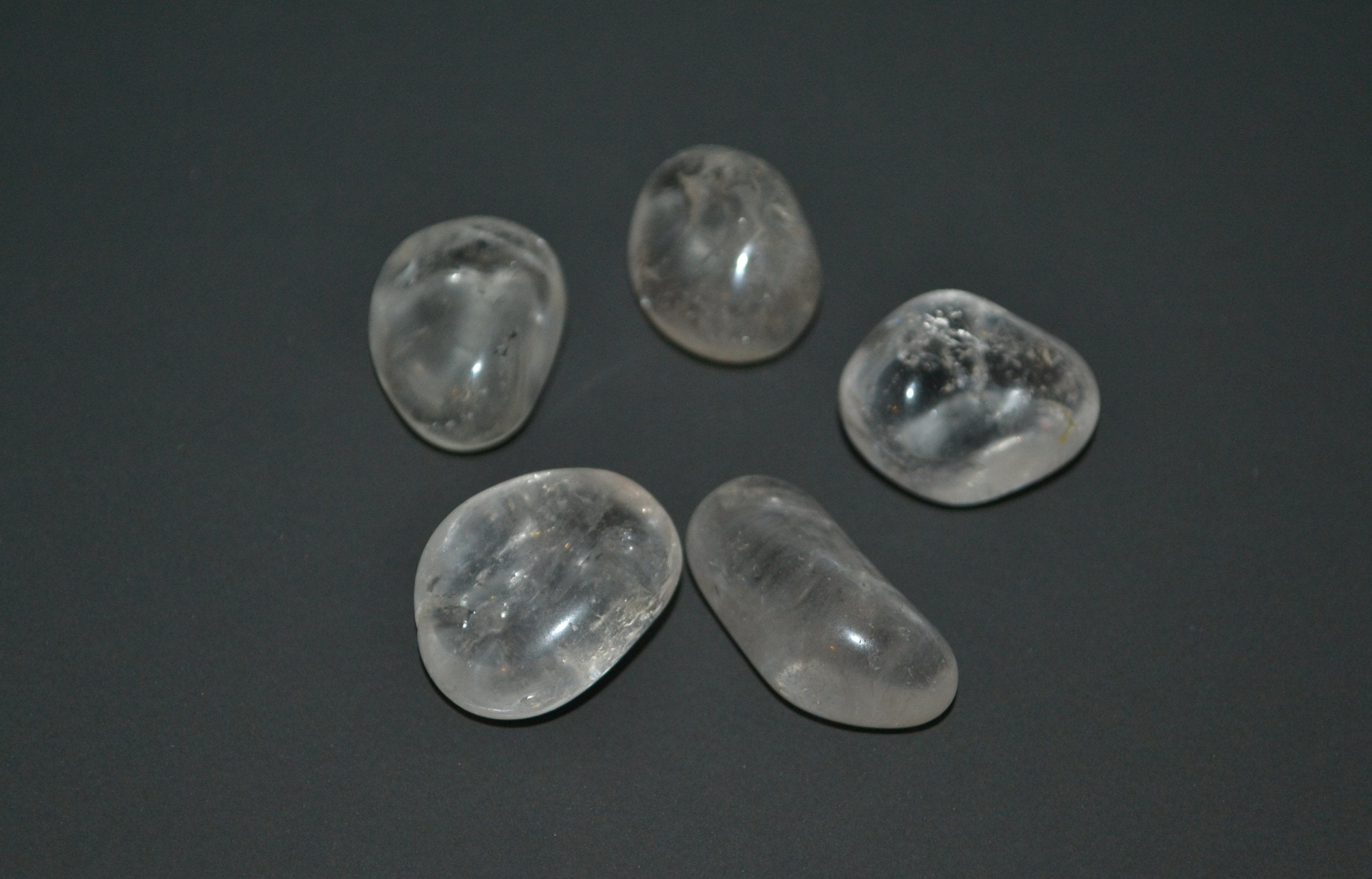 The Chrysalis Stone Clear Quartz tumbled stone showcases natural sparkle for focus and energy balance.