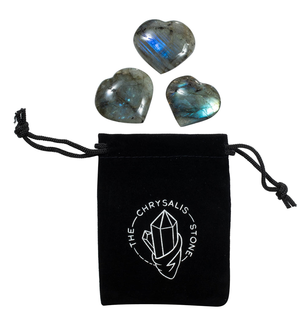 The Chrysalis Stone Labradorite puff heart in hand for anxiety relief and focus.
