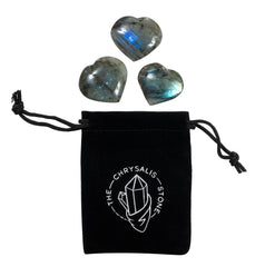 The Chrysalis Stone Labradorite puff heart in hand for anxiety relief and focus.
