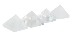 The Chrysalis Stone Pyramid Clear Quartz Mini on wood enhances calm ambient decor.
