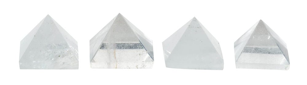 The Chrysalis Stone Pyramid Clear Quartz Mini in a yoga space supports focus and chakra balance.