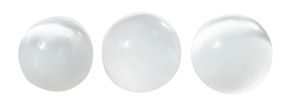 The Chrysalis Stone selenite sphere in meditation scene suggests chakra balance and mindful focus