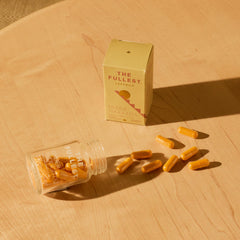 The Fullest turmeric curcumin capsules closeup emphasize natural wellness.