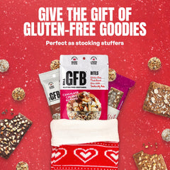 A bite of The GFB Cranberry Toasted Almond Bar showing its soft, chewy interior.