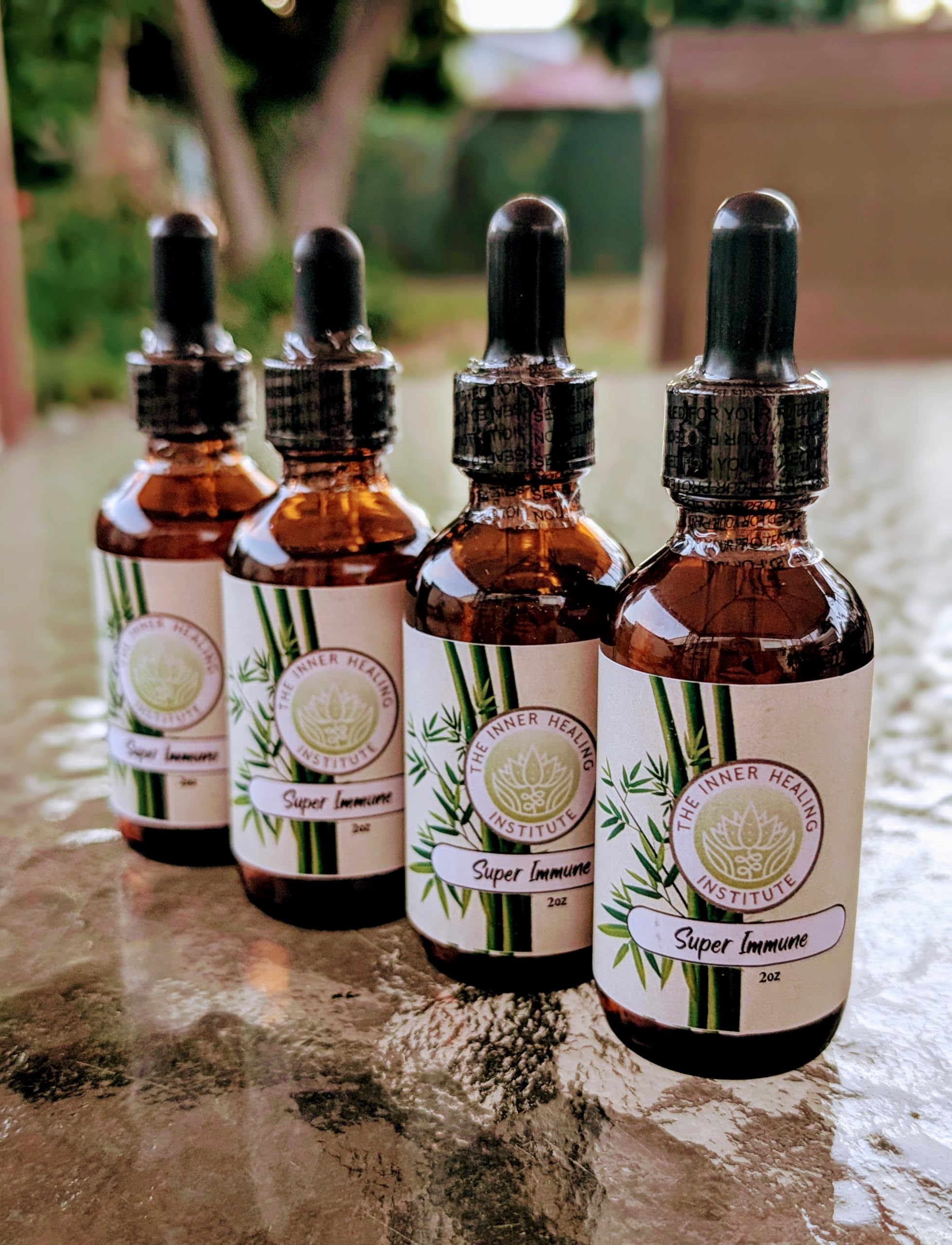 THE INNER HEALING INSTITUTE Super Immune tincture pour demonstrates easy administration.