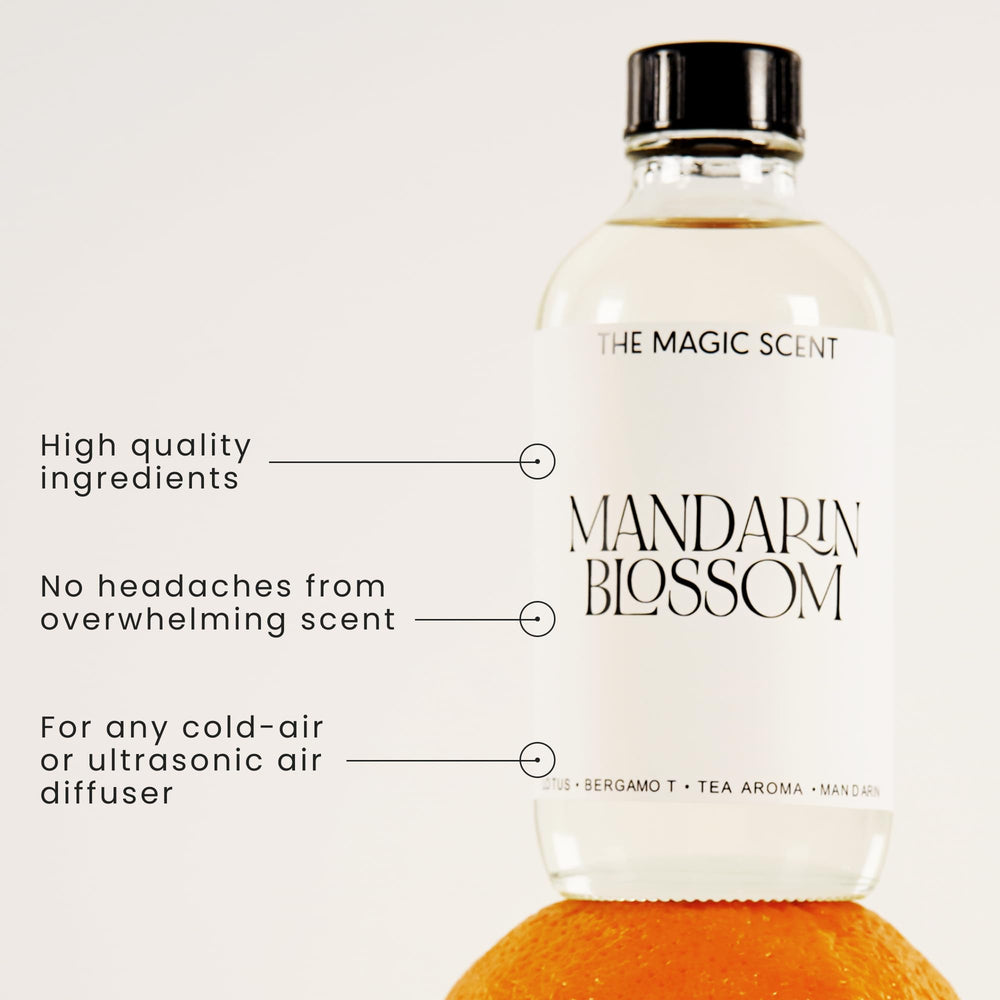 The Magic Scent Mandarin Blossom amber glass bottle on a nightstand, island-inspired aroma