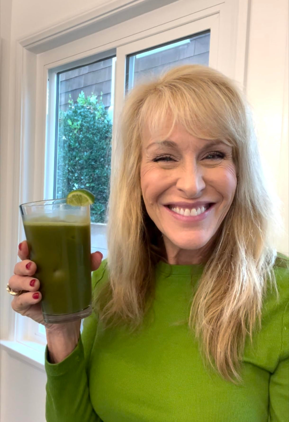 The Nerve Brand Neuropathy Superfood Blend spoon-dipping into smoothie highlights flavor