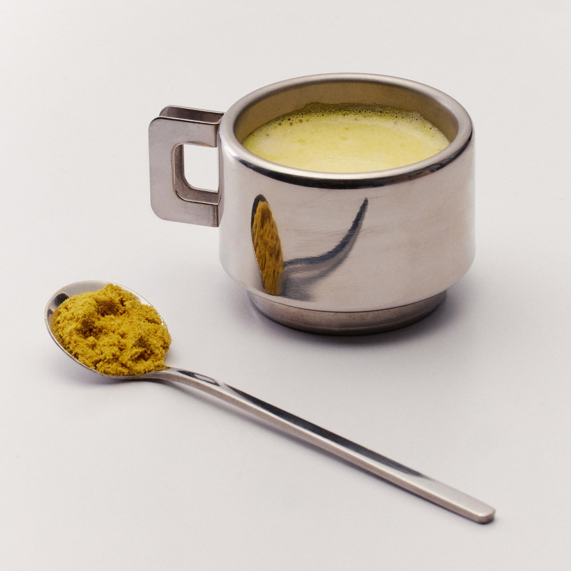 The Nue Co Debloat spoon on the table suggests a simple daily routine.