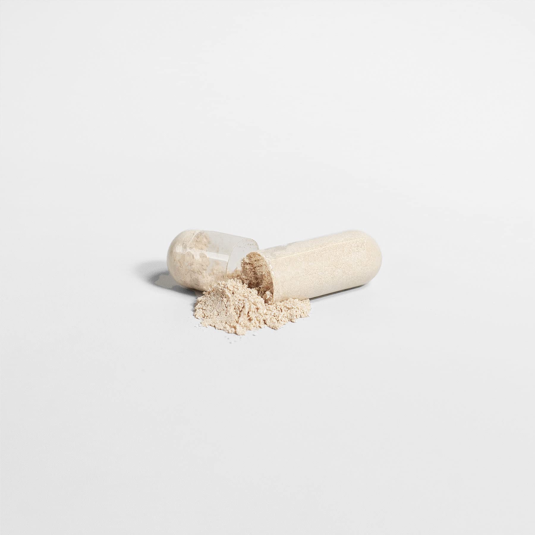 The Real Tonic capsules closeup emphasizes convenient two-capsule daily nourishment for vitality.