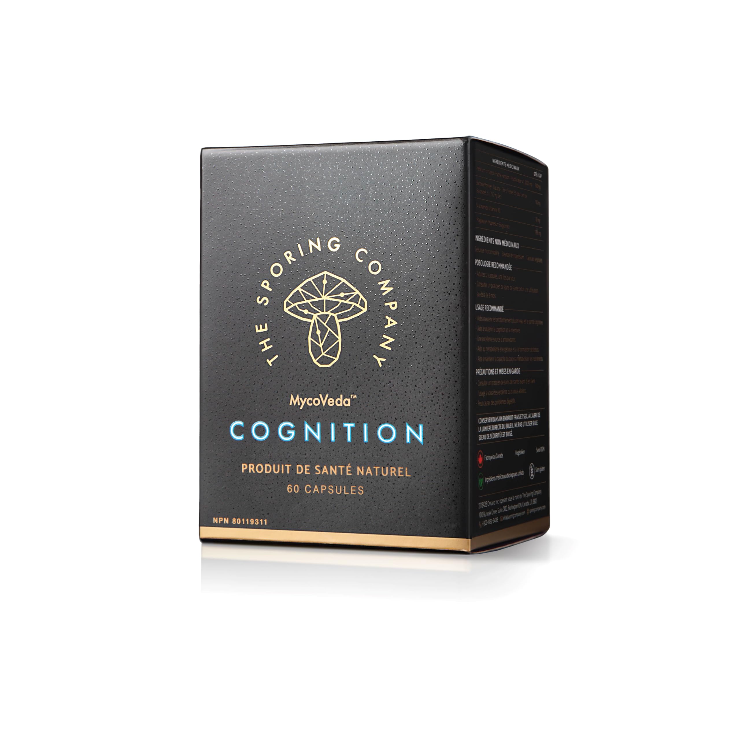 The Sporing Company Mycoveda Cognition bottle beside a glass of water for daily focus routine.