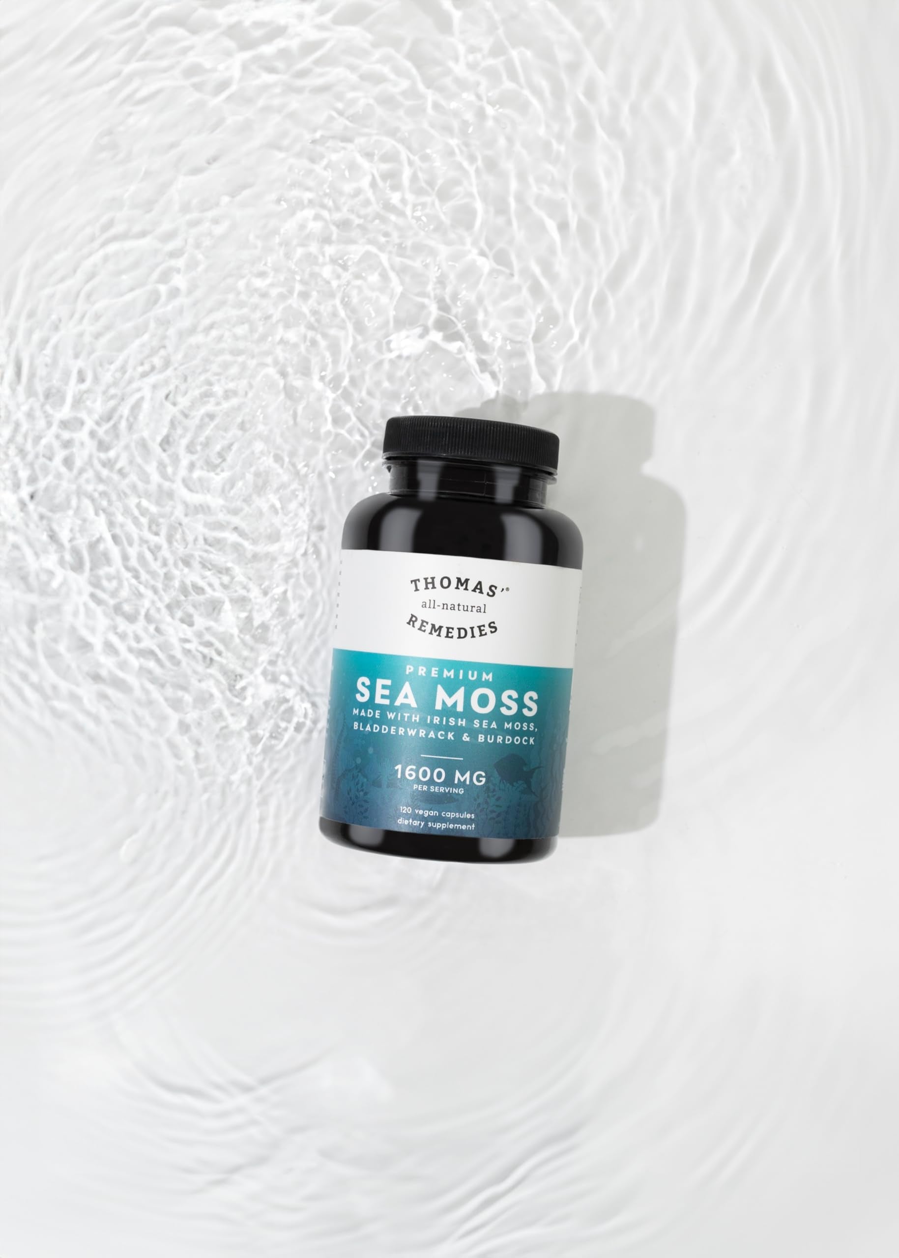 Thomas' All-Natural Remedies capsules poured into hand, convenient daily use.