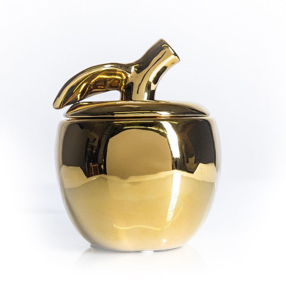 Thompson Ferrier apple-shaped ceramic jar adds an elegant autumn centerpiece.