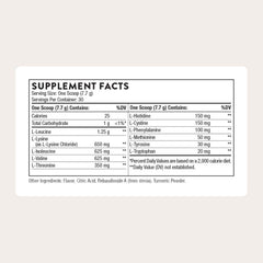 Serving scoop beside powder to illustrate convenient dosing for post-workout recovery.
