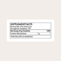THORNE Creatine powder tub close-up shows fine particles for easy mixing.