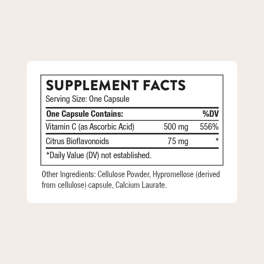 Pouring THORNE Vitamin C 500 mg bottle for daily serving