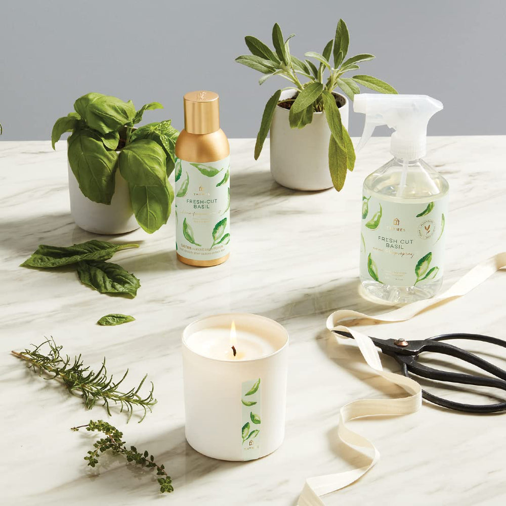 Thymes Fragrance Mist close-up highlights vibrant basil-green notes and citrus hints.