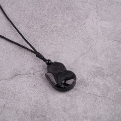 TIKCAUZ Black Obsidian Pendant close-up reveals smooth surface and unique grain.