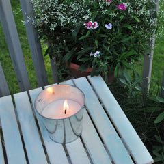 Outdoor table setup with BiteFighter candle elevates yard ambiance