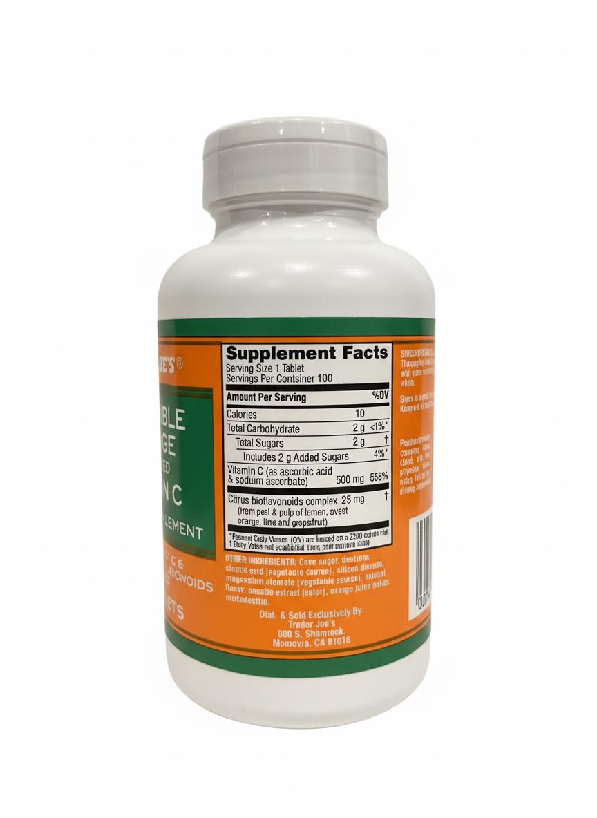 TJ's chewable orange Vitamin C tablets close-up, bright citrus flavor in a 100-tablet bottle.