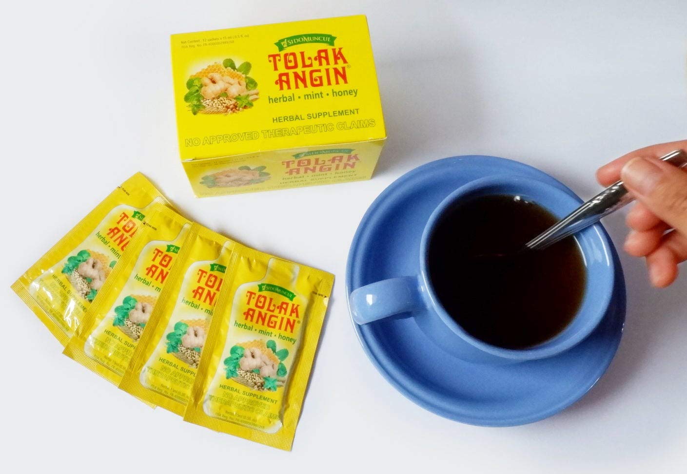 Tolakangin herbal syrup pack showing 12 sachets for on-the-go use.