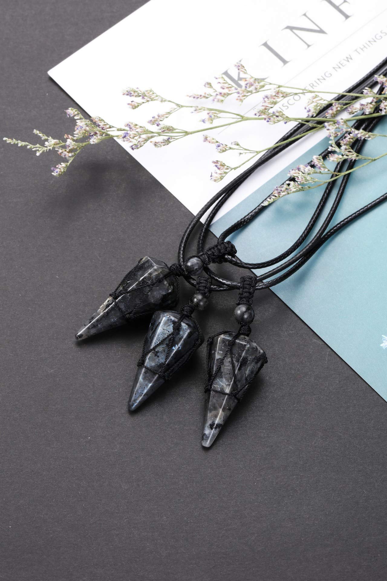 Top Plaza pointed pendant measures 37-39mm for bold, elegant look.