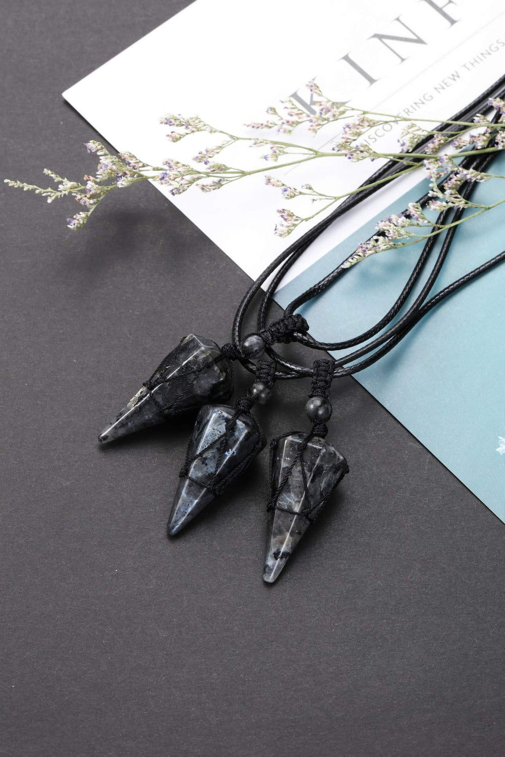 Top Plaza pointed pendant measures 37-39mm for bold, elegant look.