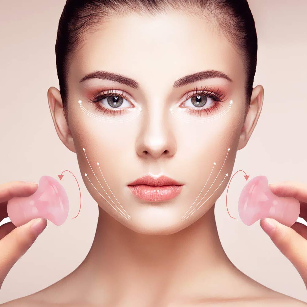 TOP-VRA Rose Quartz mushroom gua sha used on the neck to ease tension.