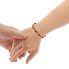 Touchstone craft detail of copper-brass braid highlighting hand-forged finish