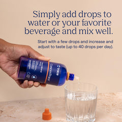 Trace Minerals ConcenTrace bottle held in hand for on-the-go remineralization