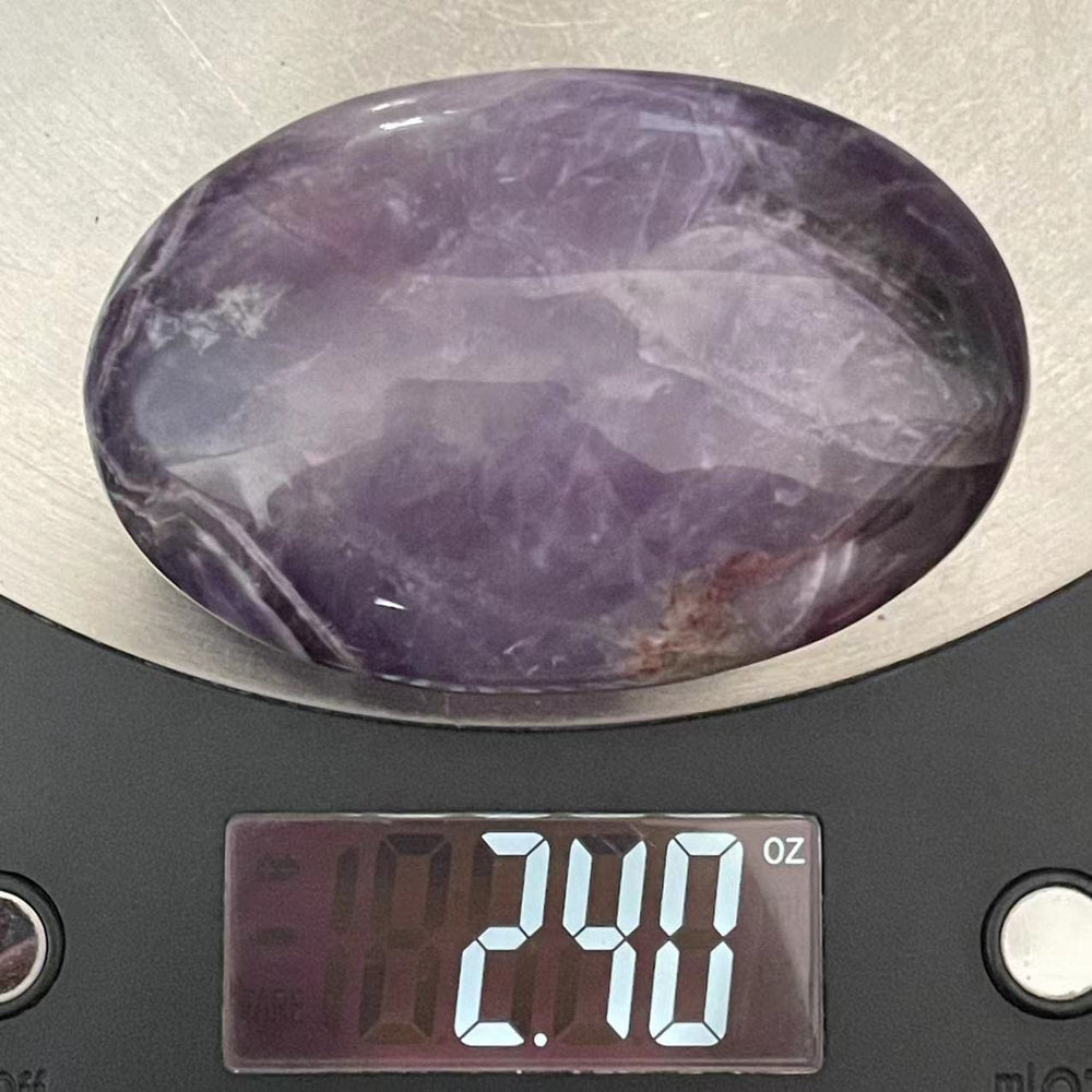 Truewon Amethyst palm stone oval on altar for chakra balancing practice