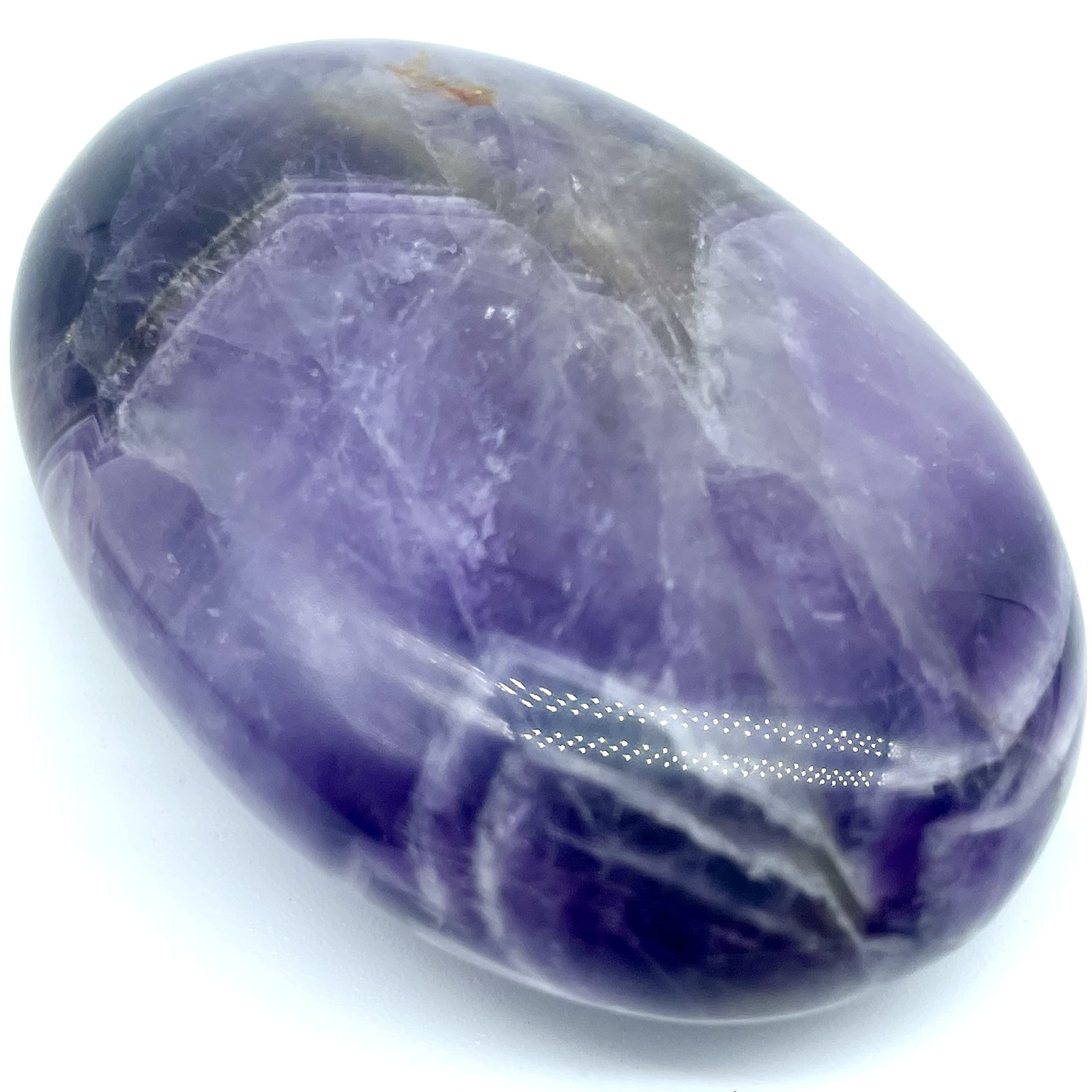 Truewon Amethyst palm stone oval held during meditation sessions for calm focus