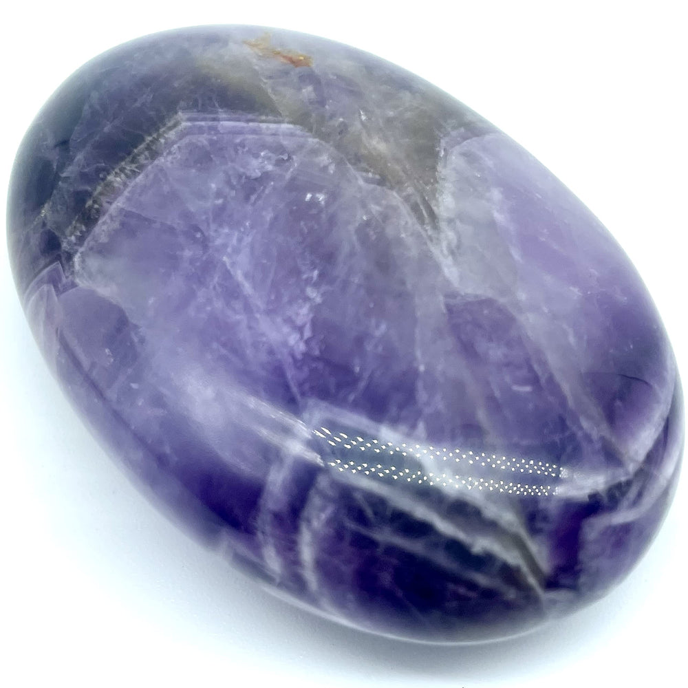 Truewon Amethyst palm stone oval held during meditation sessions for calm focus