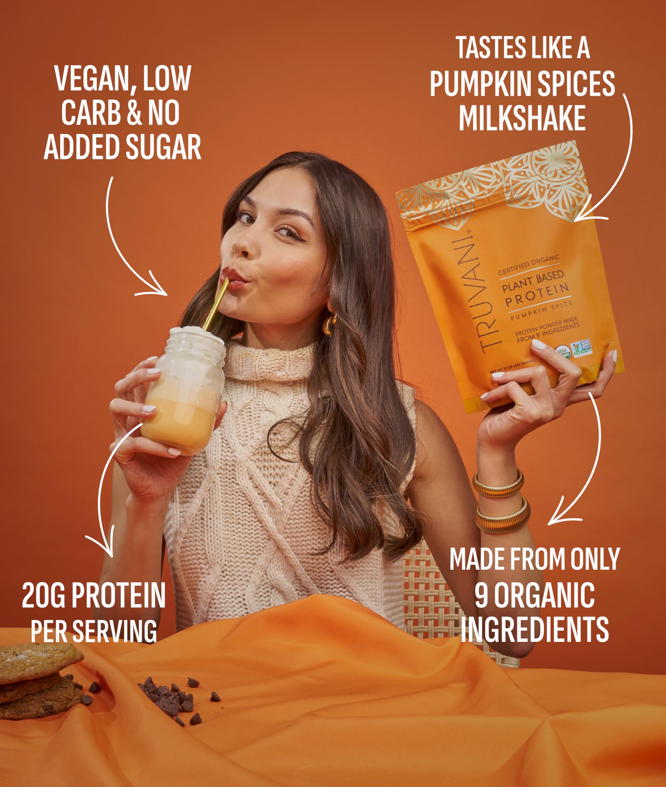 Truvani vegan pea protein pumpkin spice scoop beside jar with label detail.